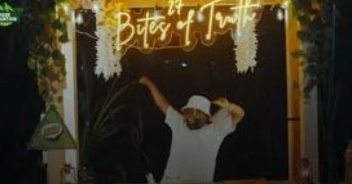 A host dancing under a neon Bites of Truth sign