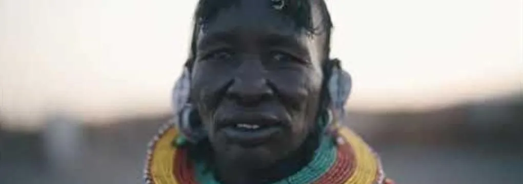 A woman from Turkana in beaded necklaces, from Tedmade's Turkana travel film